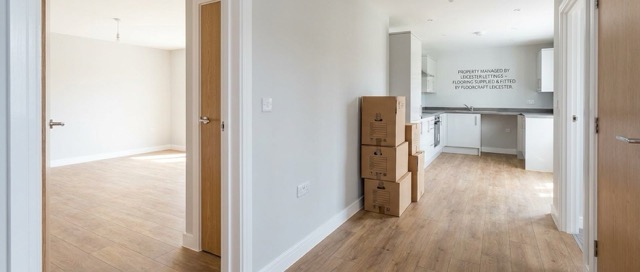 Freshly fitted rental property with light wood-effect flooring